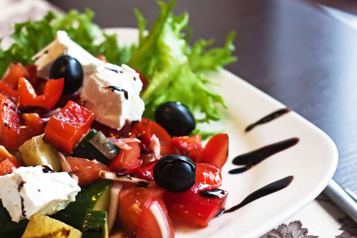 Greek salad served on white plate