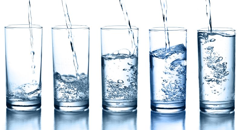 Pouring water in a glass collection